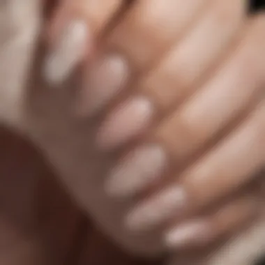 Close-up of a hand with ballerina nails featuring intricate designs