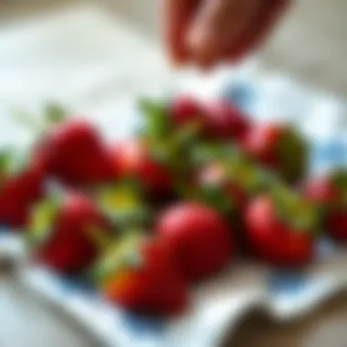 Strawberries being placed on a clean cloth