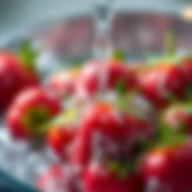 Close-up of rinsed strawberries under running water