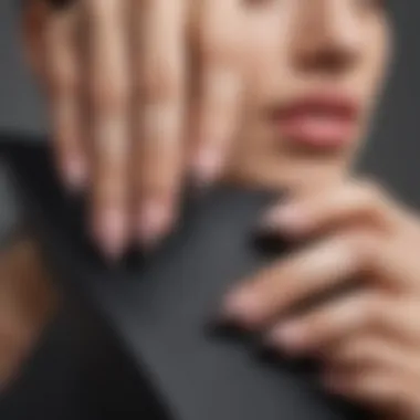 Close-up of a hand with beautifully manicured triangular nails